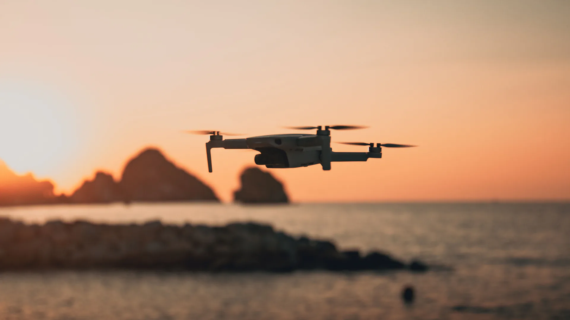 Small quadcopter in open sky as a target for radar, RF, optical, and acoustic detection