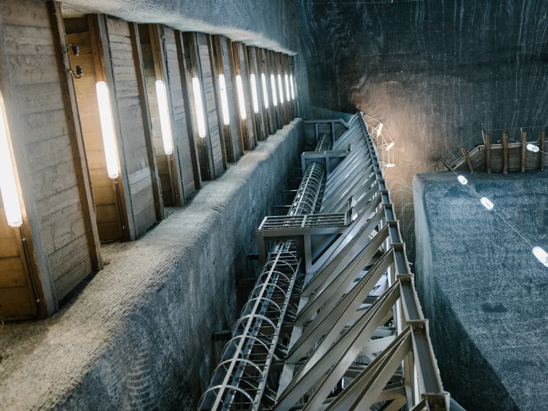 Underground mine tunnel where atmospheric sensors, communications, and personnel systems depend on the ventilation layout