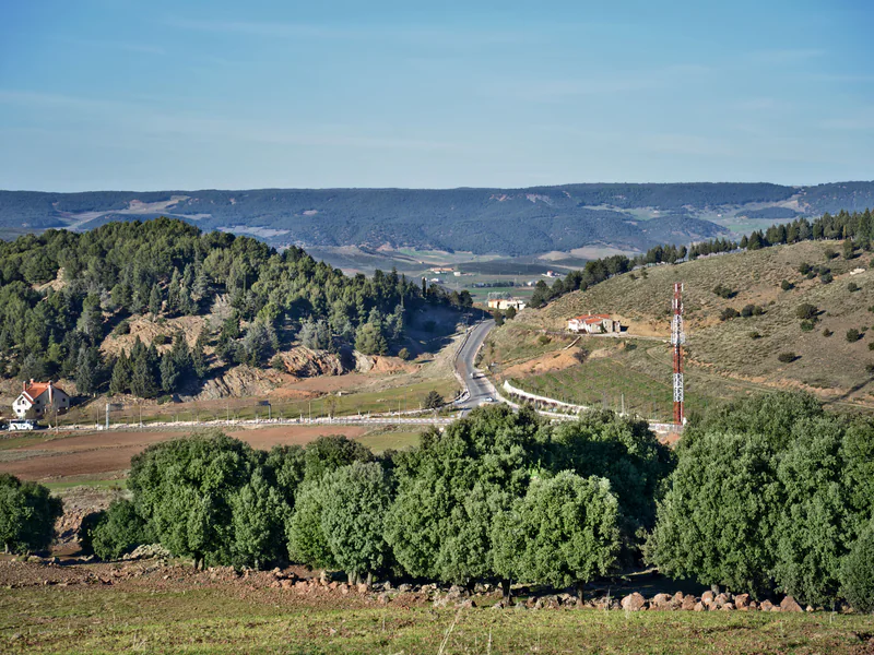 Remote hilly patrol corridor with communications masts and terrain that can block line-of-sight links