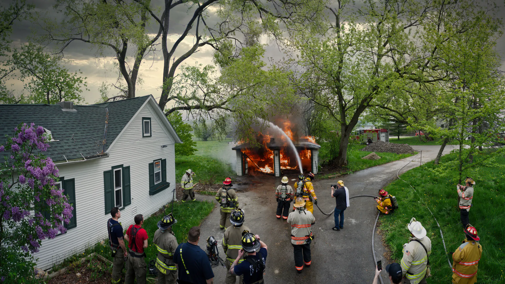 Emergency crews at a residential fire where drone information must enter incident command