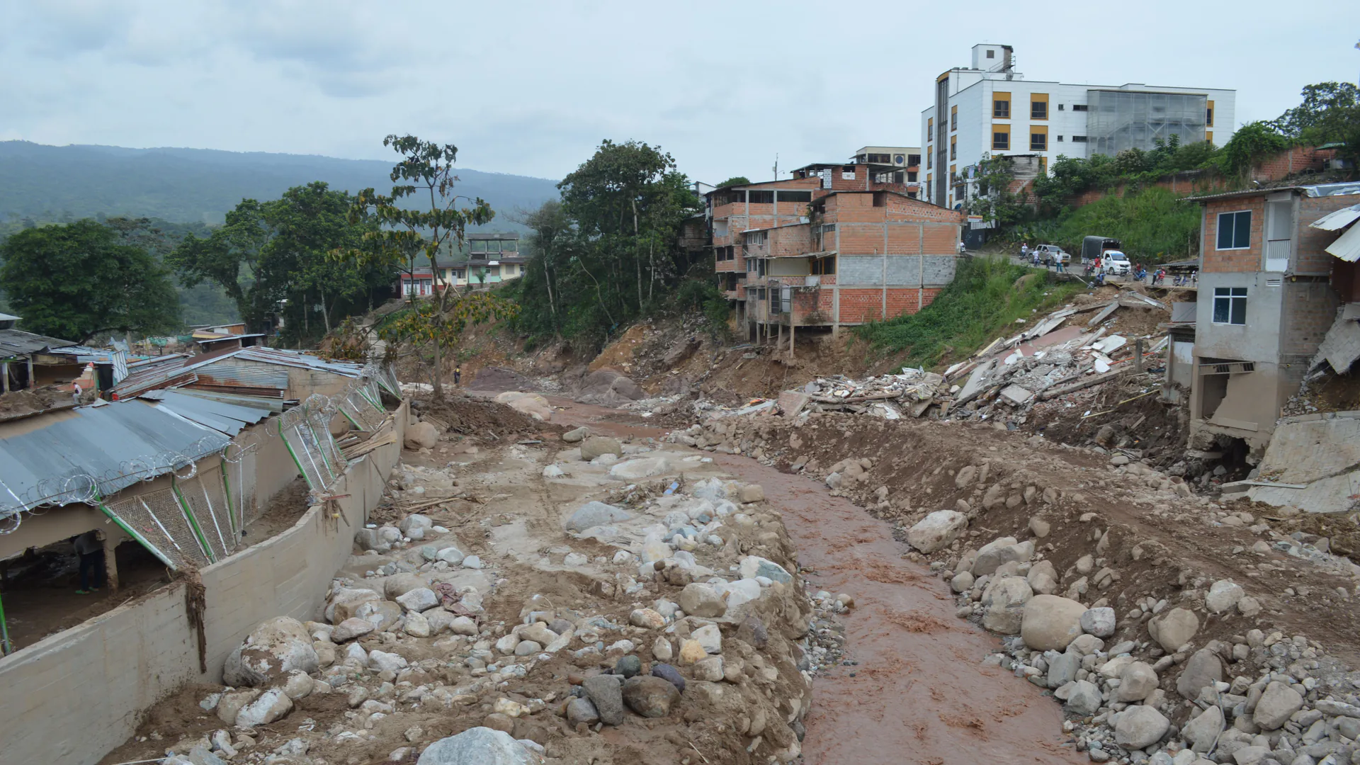 Homes and access routes damaged by a landslide where warning time and evacuation decisions matter