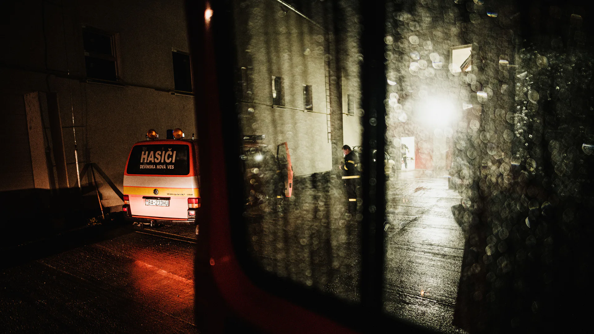 Emergency response scene at night showing the contrast and shadow conditions an aerial searchlight must manage