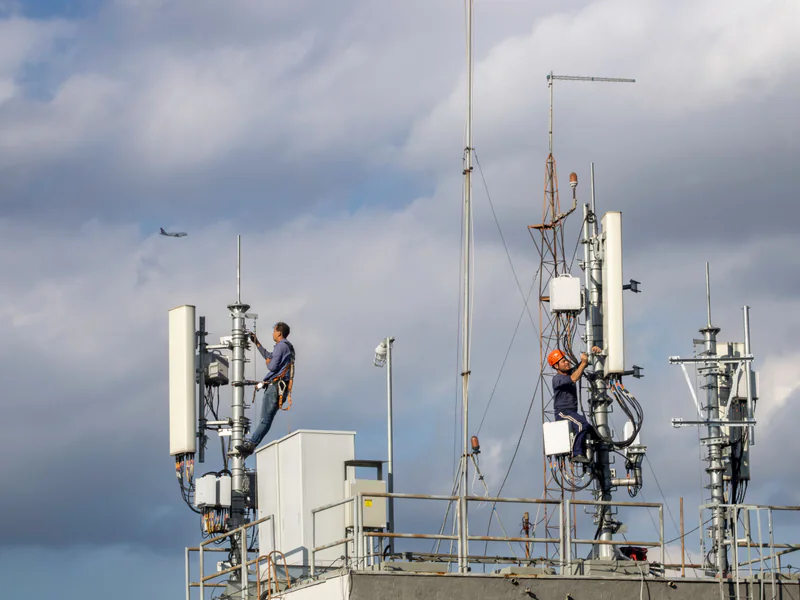 Field maintenance activity at a communications tower where aerial findings are converted into traceable work orders