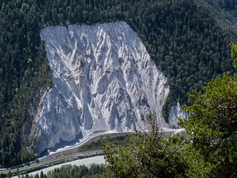 Steep engineered slope illustrating the terrain and visibility constraints of a GNSS deformation-monitoring network