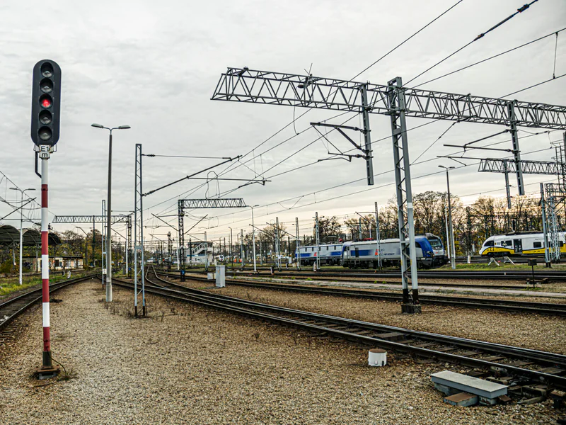 Trackside railway signal and rails showing how inspection findings must be tied to a precise corridor location