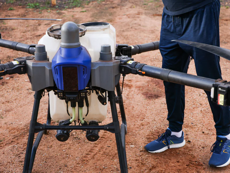 Field team reviewing drone mission data where labor software and support contribute to lifecycle cost
