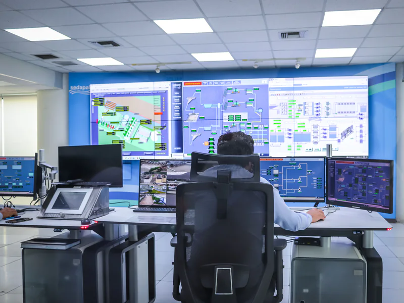 Industrial control room where drone inspection evidence is reviewed against process state and maintenance actions