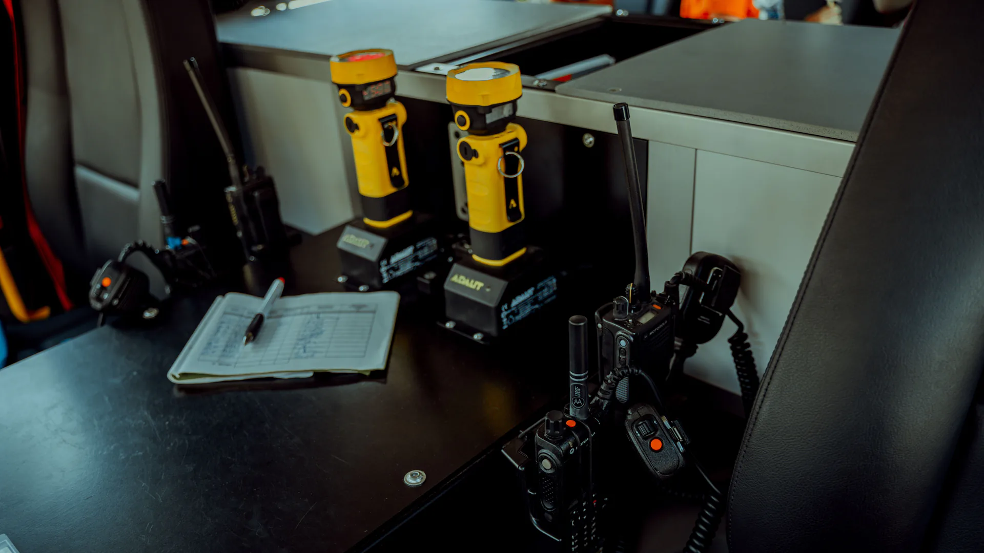 Portable radio and security equipment illustrating the field kit and alert workflow around a mobile drone detector